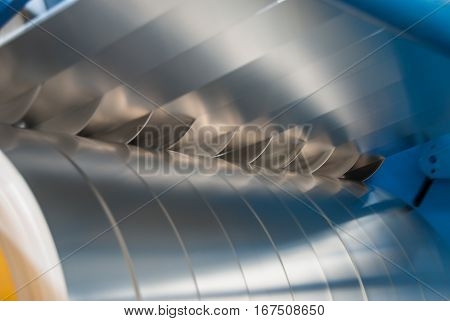 Sheet metal strips exiting the slitting line