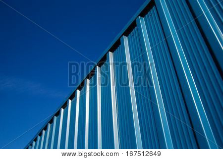 Corrugated blue steel sheet metal facade panels