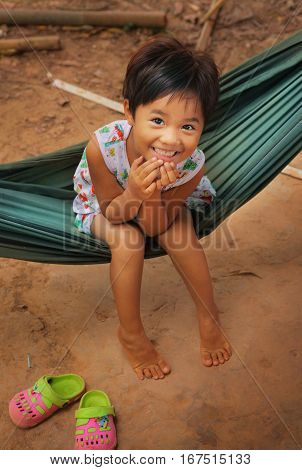 Ho Chi Minh, Vietnam, Januar 15, 2017: Unidentified vietnamese little girl in hammock close up photo in in Ho Chi Mihn city, Vietnam, Januar 15, 2017.