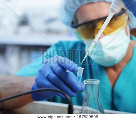 Scientist filling test tube science lab