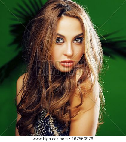 young cute blonde woman on green palm background smiling happy, lifestyle peole concept close up