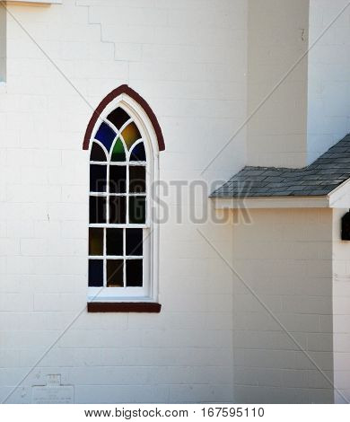 stained glass window white brick church building