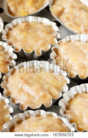 Steamed banana cake in stainless cups - Thai dessert
