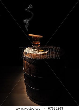 Cognac ,cigar And Dollars On Old Oak Barrel