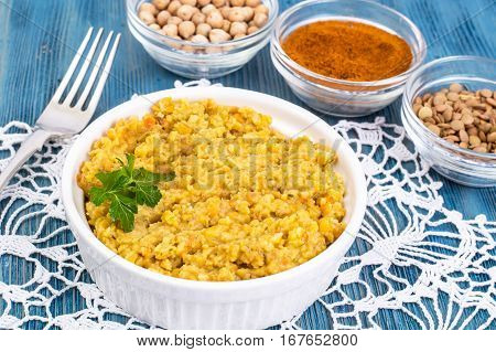 Hummus chickpea puree with curry and saffron. Studio Photo