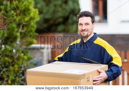 Courier delivering parcel to recipient