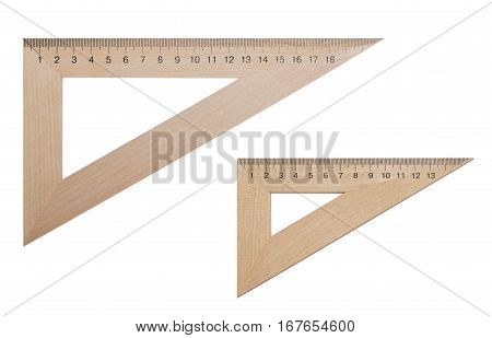 Two triangular ruler made of wood 20 and 15 centimeters on a white isolated background. Office supplies education