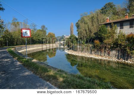Old bridge over the Naviglio Grande of Turbigo (Milan Lombardy Italy) at fall.