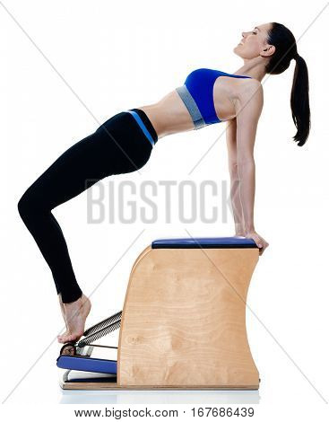 one caucasian woman exercising fitness pilates exercices isolated on white background