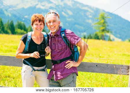 An active snior couple is having fun outdors, enjoying summer.