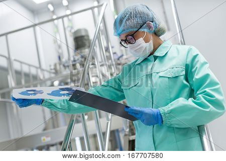 Scientist Exploring Graphs On Tablet