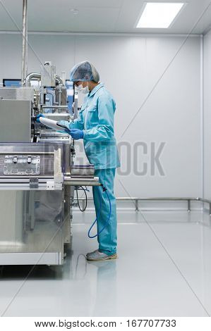 Scientist Is Making Notes About Machine