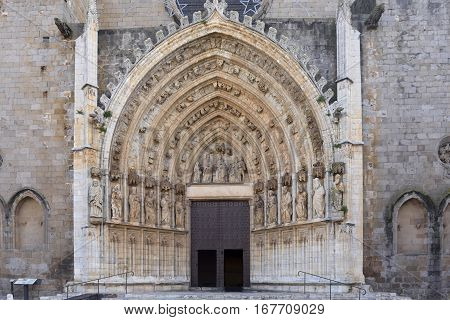 Entrance of the gothic cathedral of Santa Maria in Castello d Empuries Girona province Catalonia Spain