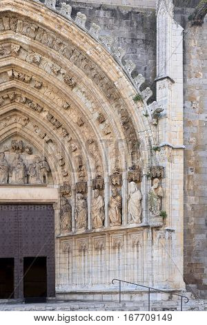 Entrance of the gothic cathedral of Santa Maria in Castello d Empuries Girona province Catalonia Spain