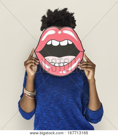 African Woman holding Peper Mouth Over her Face