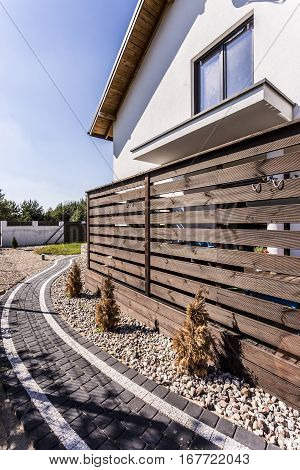 House Exterior With Wooden Arbour