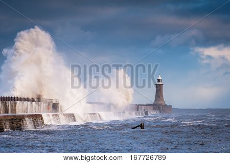 Storm Waves hit Tynemouth Pier, as a stormy sea hits it, resulting in high crashing waves cascading into the mouth of the River Tyne