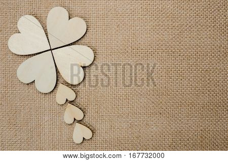 Wood hearts on hessian texture background valentine background