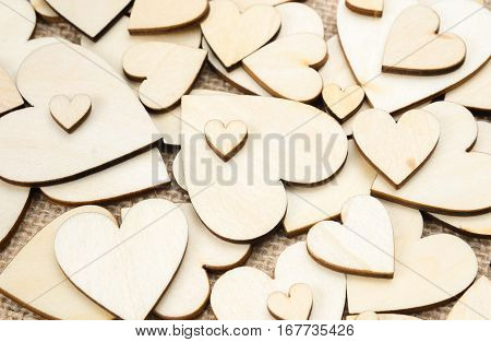Wood hearts on hessian texture background valentine background