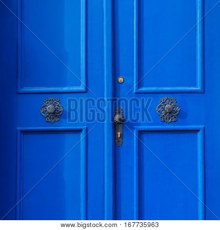 Traditional european vivid blue entance door close-up