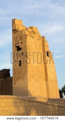 Ruins of an ancient temple of Egypt with statues and columns