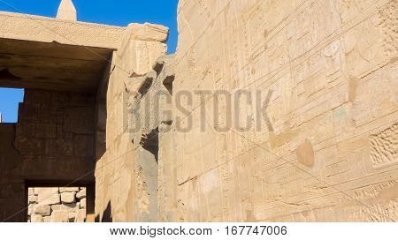 Ruins of an ancient temple of Egypt with statues and columns