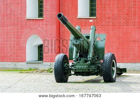Artillery gun on a wheeled platform standing in the courtyard of the Peter and Paul fortress in Saint-Petersburg.