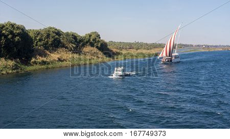 Egypt Nile cruise, a nice view from the boat to shore. Ship sails behind