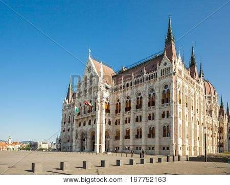 BUDAPEST HUNGARY - JUNE 16 2016: Hungarian National Parliament building located at the bank of the Dunabe connecting Buda and Pest in Budapest Hungary - June 16 2016