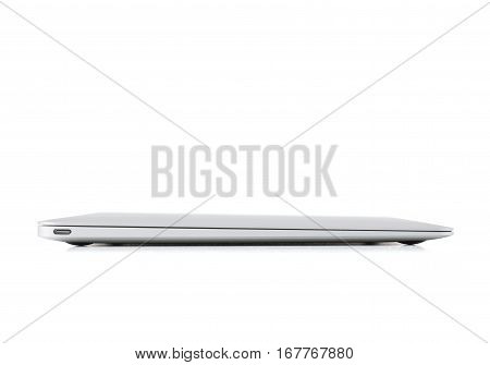 Closed laptop side view ultra thin on white background