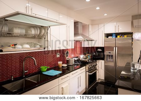 Modern designed kitchen with electrics and appliances.