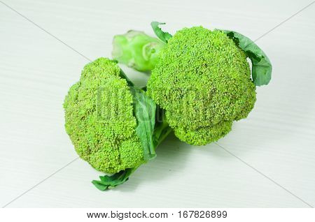 broccoli over white wood. broccoli isolated. vegetable green broccoli