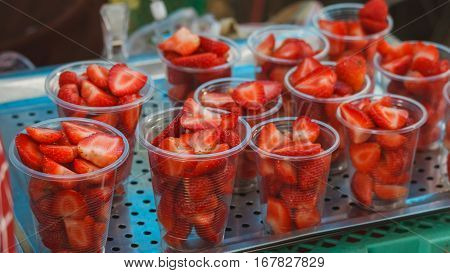 Fresh ripe strawberries in a glassine,in Thai market