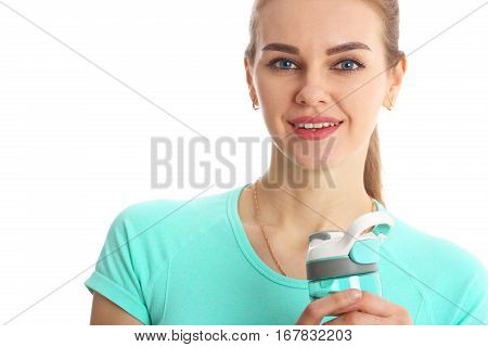 Smile fitness woman holding a jar of water sports. Isolated on white.