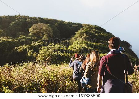 Group of people walking on mountain in morning sunrise, trekking on the Kew Mae Parn, National Park mountain