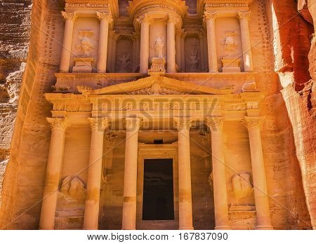 Yellow Golden Treasury Morning Siq Petra Jordan Petra Jordan. Treasury built by the Nabataens in 100 BC. Yellow Canyon becomes rose red in afternoon. Inside buildings walls create many abstracts close up. The rose red can become blood red. Reds are create