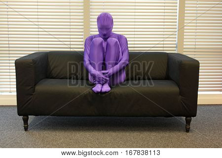 loneliness - anonymous, crooked,depressed,man sitting on sofa in office, 