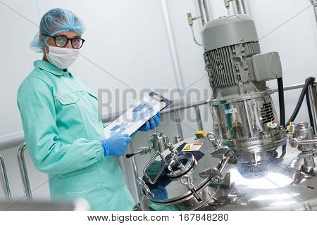 Plant Picture, Scientist Standing Near Big Steel Tank With Tablet