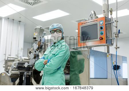 Factory Worker Stand Near Control Panel