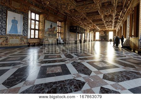 HILLEROD, DENMARK - DECEMBER 27, 2016: Visitors in Frederiksborg Castle. It was built as a royal residence for King Christian IV and becoming the largest Renaissance residence in Scandinavia