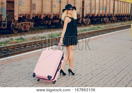 beautiful girl at raiway station. uses communication
