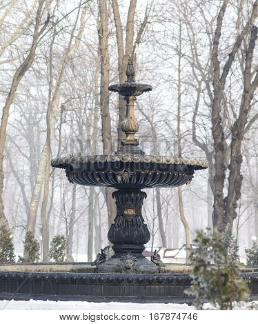 Snowy day by Mariinsky Park's famous Theremin Fountain. Selective Focus.