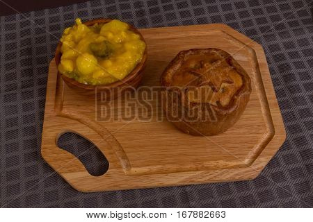 Game Pie Served With Bowl Of Piccalilli