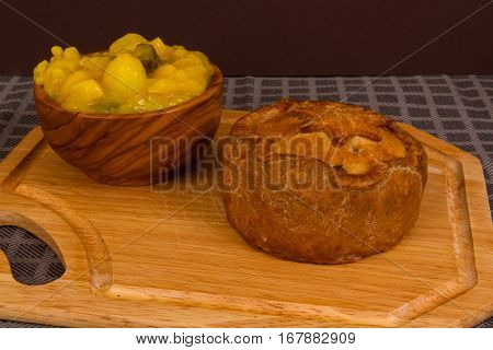 Game Pie Served With Bowl Of Piccalilli