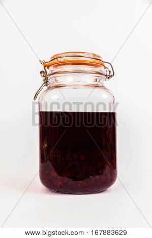 Blackberries in sherry maturing in resealable jar.