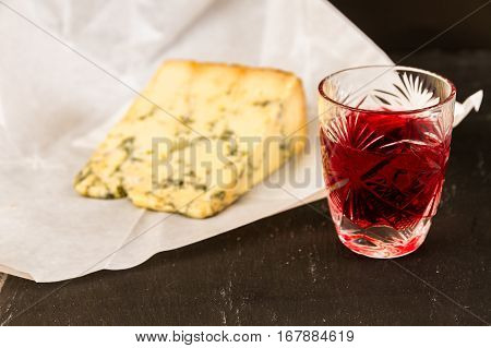 Glass Of Sloe Gin With Stilton Cheese
