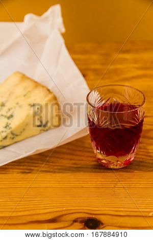 Glass Of Sloe Gin With Stilton Cheese