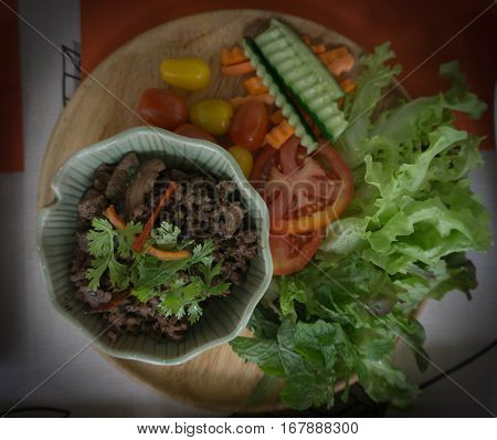 Stir fried beef and vegetable served on plate.