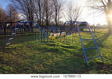 New Alresford, Uk - Jan 28 2017: Climbing Frame Shaped Like A Spider Or Insect, In Evening Sun At A