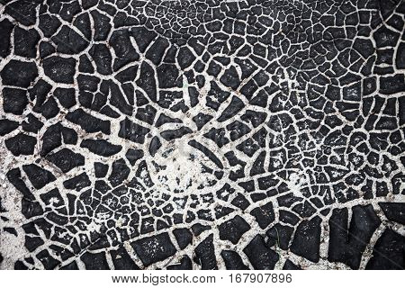 The surface texture with cracked black tar.
